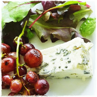 blue cheese with sauteed grapes
